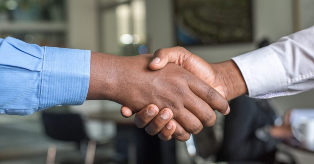 two people shaking hands